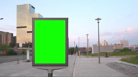 Empty billboard with a green screen for advertising in the beautiful street Stock Footage 142201634