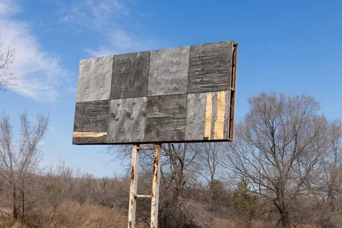 An empty billboard standing on the edge of the road Stock Photos