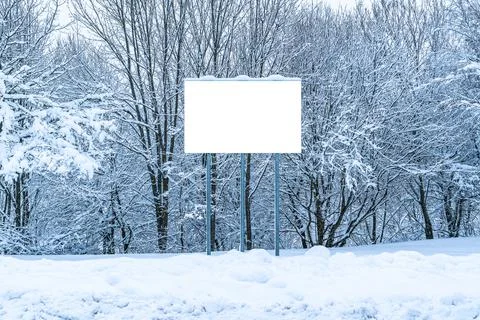 Empty billboard standing in a snowdrift Stock Photos