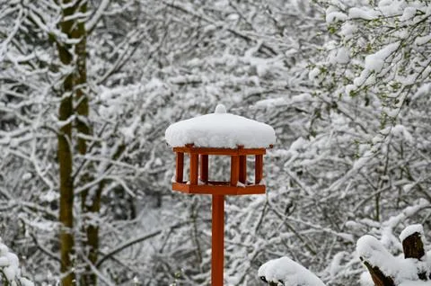 Empty bird feeder in the snow Stock Photos