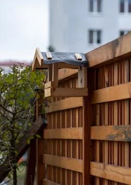 Empty bird feeder at terrace Stock Photos