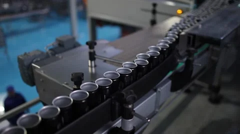 Empty black aluminium cans moving on conveyor in a factory Stock Footage 55911287