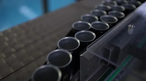 Empty black aluminium cans moving on conveyor in a factory Stock Footage 55911299