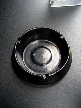 Empty Black Ashtray on an Iron table 1 Stock Photos
