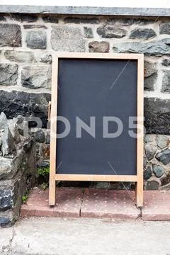 Empty black board with copy space for advertising. Blank dark board with empty Stock Photos