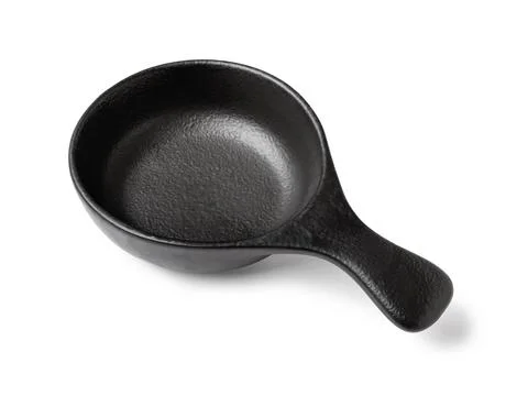 Empty black ceramic sauce dish with handle, modern kitchenware and tableware  Stock Photos