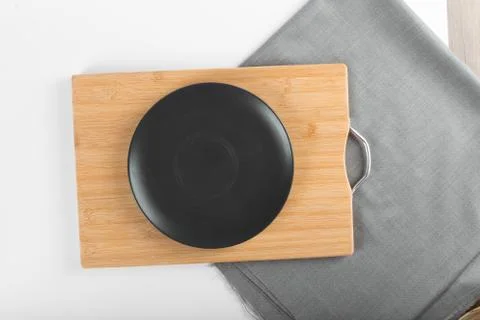 An empty black ceramic saucer Stock Photos