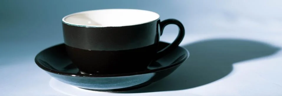 Empty black cup Stock Photos