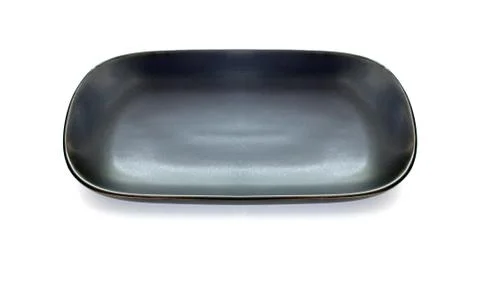 Empty black dish isolated on white Stock-Fotos