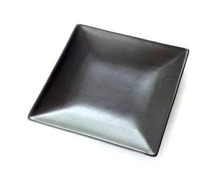 Empty black dish isolated on white Stock Photos