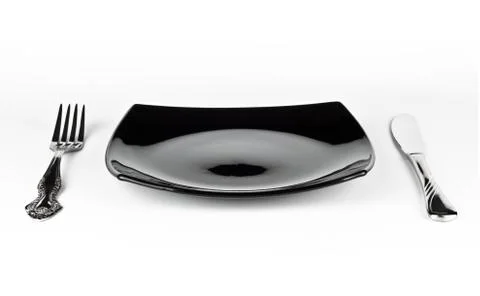 Empty black dish knife and fork Stock Photos
