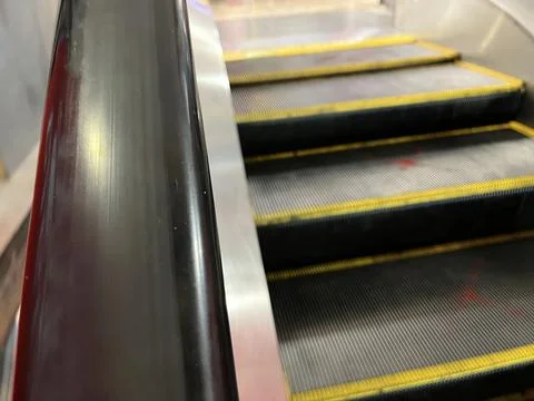 Empty black escalator railing in a mall Stock Photos