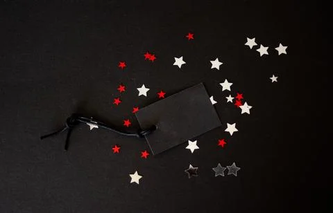 Empty black label on dark background with stars.Copy space Stock Photos