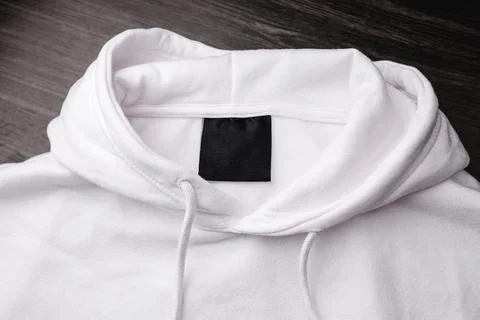 Empty black label on white sweatshirt for logo, size and info. Foto stock