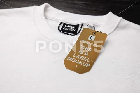 Empty black label on white sweatshirt for logo, size and price. PSD Template