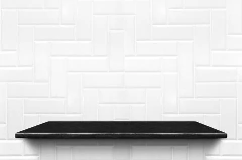 Empty black marble shelf at white ceramic tile wall pattern background,Mock u Stock Photos