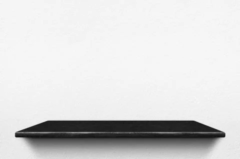 Empty black marble stone shelf at white concrete wall background,Mock up for  Stock Photos