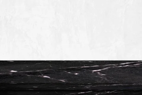 Empty black marble table over white cement wall background Stock Photos