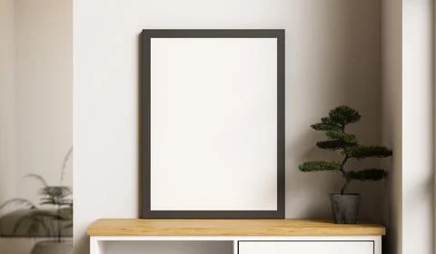 Empty black photo frame and bonsai tree pot on wooden table aside white wal.. Stock-Illustration