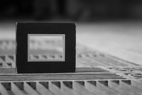 Empty black photo frame on newspaper background Foto stock