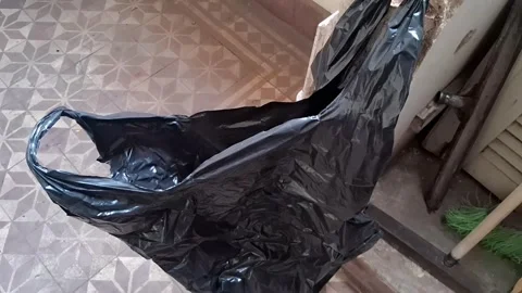 Empty black plastic bag swaying in motion for video footage Stock Footage 339349208