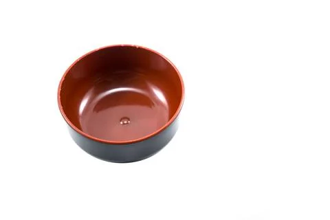 Empty black plastic bowl with red inside isolated on white Stock Photos
