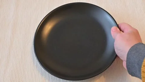 Empty Black Plate Placed on Table, Minimal Dining Concept Stock Footage 337014559