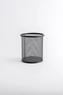 Empty black round metal mesh pen holder cup isolated on white background Stock Photos