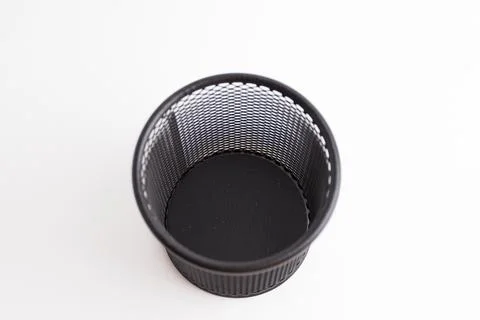 Empty black round metal mesh pen holder cup isolated on white background Stock Photos