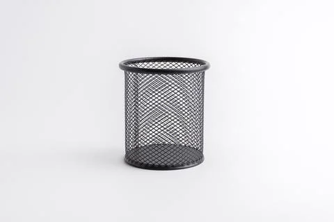 Empty black round metal mesh pen holder cup isolated on white background Stock Photos