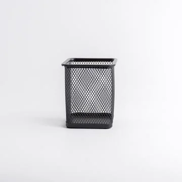 Empty black square metal mesh pen holder isolated on a white background Stock Photos