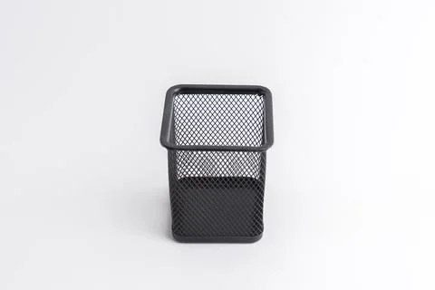 Empty black square metal mesh pen holder isolated on a white background Stock Photos