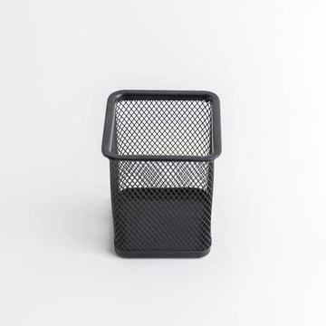 Empty black square metal mesh pen holder isolated on a white background Stock Photos