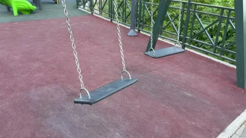 Empty black swings on chains without backrests Stock Footage 311008337