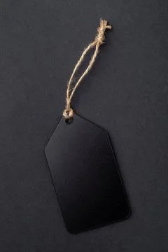 Empty black tag on black background Foto stock