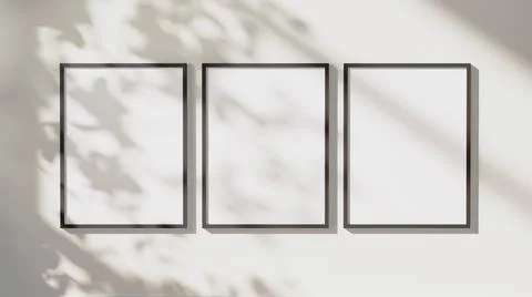 Empty black vertical rectangular frames mock up with leaves shadows and sunli Stock Illustration