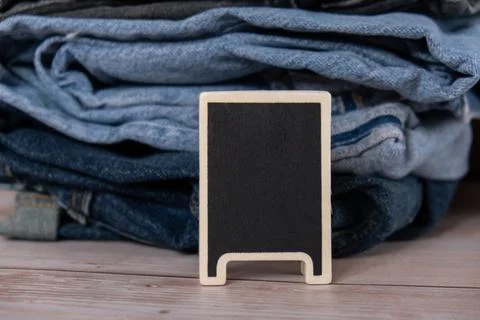 Empty blackboard with copy space for your text. Abstract Stack of jeans Foto stock