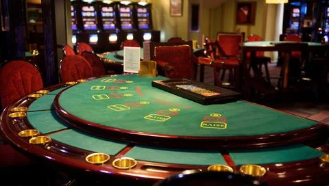 An empty blackjack table in a casino in green tones Stock Photos