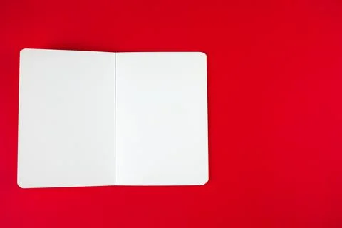 Empty blank paper notebook or book mockup on red background. White empty paper Stock Photos