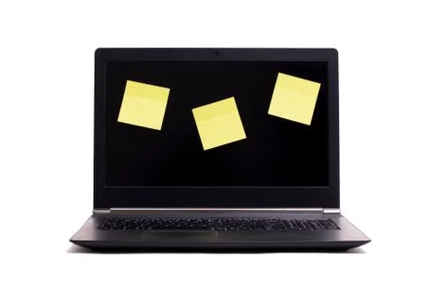 Empty blank post it notes on a black laptop Foto stock