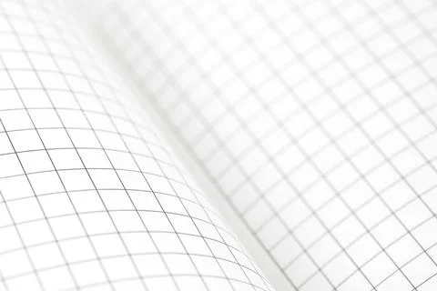 Empty blank sheet of maths paper on working table. Close up. Selective focus. Stock Photos