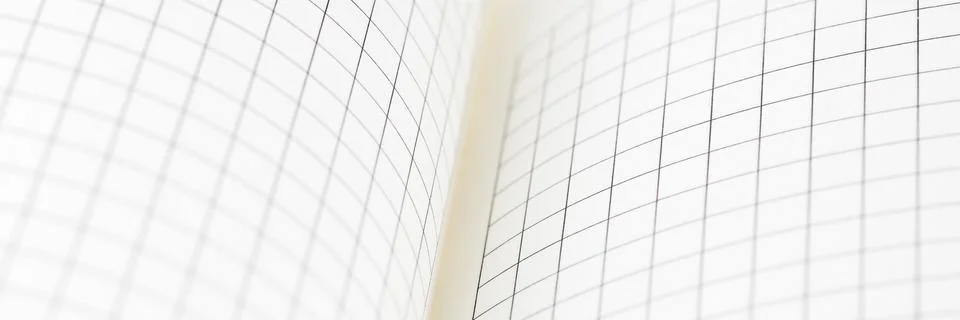 Empty blank sheet of maths paper on working table. Office stationery concept. Stock Photos