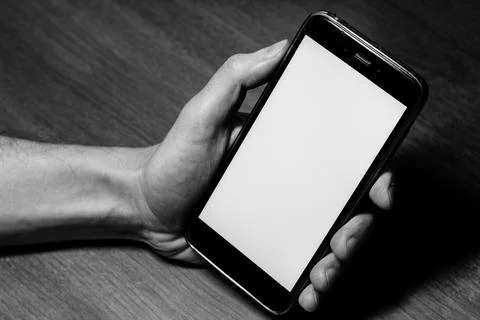 Empty, blank, white screen smartphone. Gadget in hand close up with free copy Stock Photos