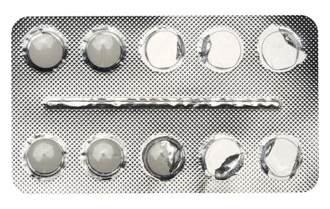 Empty blister pack of round pills on a white isolated background 스톡 사진