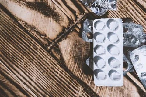 Empty blister packs on the table, top view. Health care idea Stock Photos