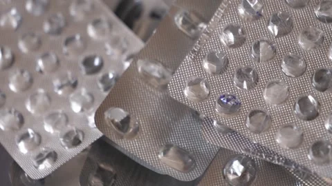 Empty blisters in a pile rotating, close-up. Stock Footage 304248242