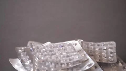 Empty blisters in a pile rotating, close-up. Stock Footage 304248253