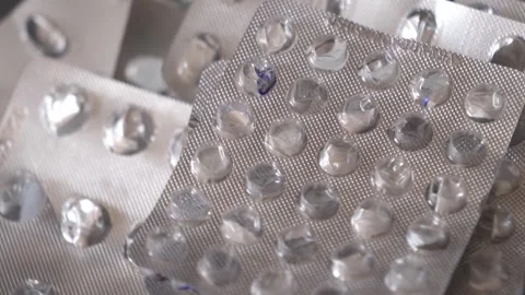 Empty blisters in a pile rotating, close-up. Stock Footage 304248277