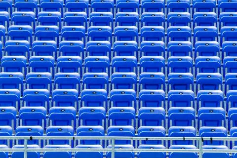 Empty blue bleachers Fotos de archivo