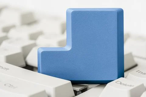 Empty blue button removed from computer keyboard Stock Photos
